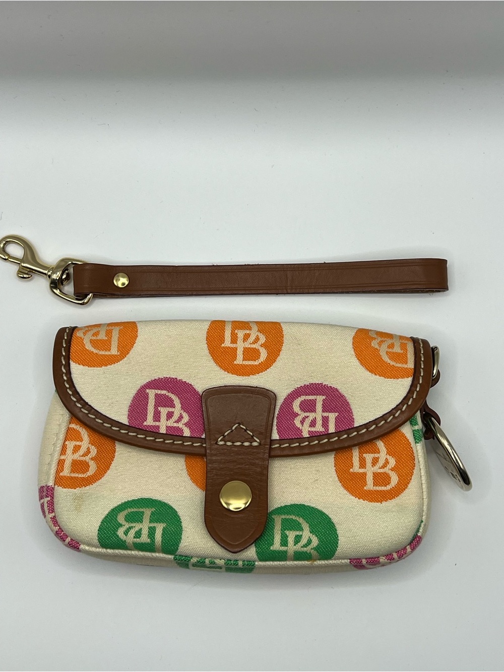 Dooney & Bourke Cream Canvas Wristlet with Orange, Pink & Green Logo